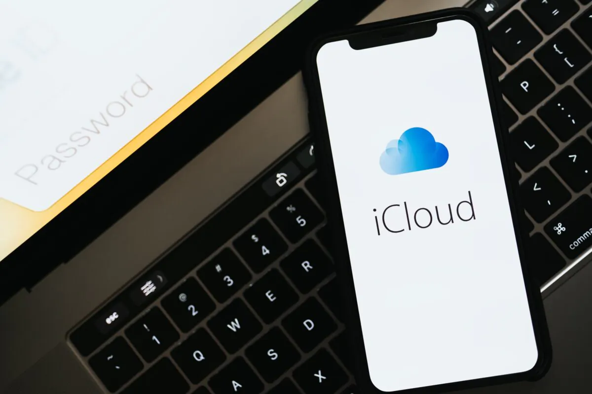 The iPhone uses iCould is put on top of a MacBook Pro in Russia on Oct. 28, 2019. (nikkimeel/Shutterstock)