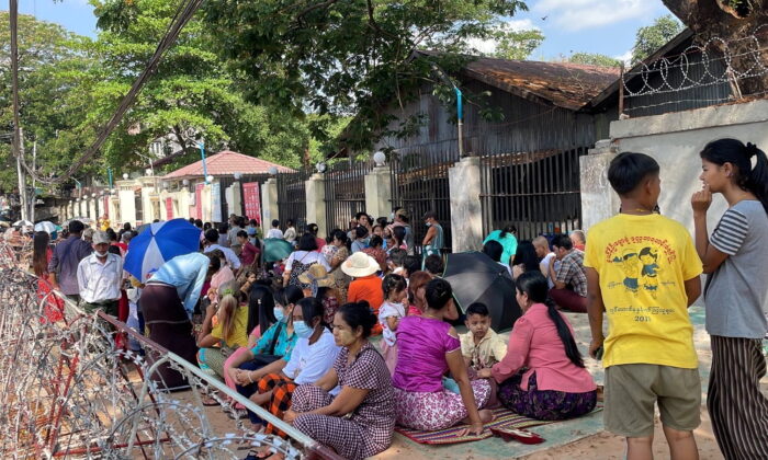 People wait at Insein prison in hopes of the release of their families members who were arrested due to the anti coup protests, in Yangon, Burma, on April 17, 2022. (Assistance Association for Myanmar-Based Independent Journalists/Handout via Reuters)