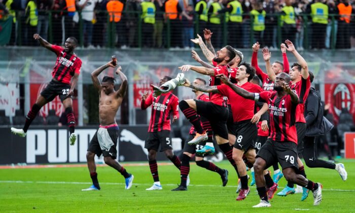 AC Milan players celebrate at the end of the Serie A soccer match between AC Milan and Genoa, at the San Siro stadium in Milan, Italy on April 15, 2022. (Luca Bruno/AP Photo)