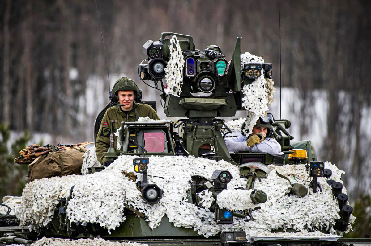 Soldiers from the Norwegian Armed Forces operate a tank as they participate in the international military exercise Cold Response 22, at Setermoen, North of in Norway, on March 22, 2022. (Jonathan Nackstrand/AFP via Getty Images)