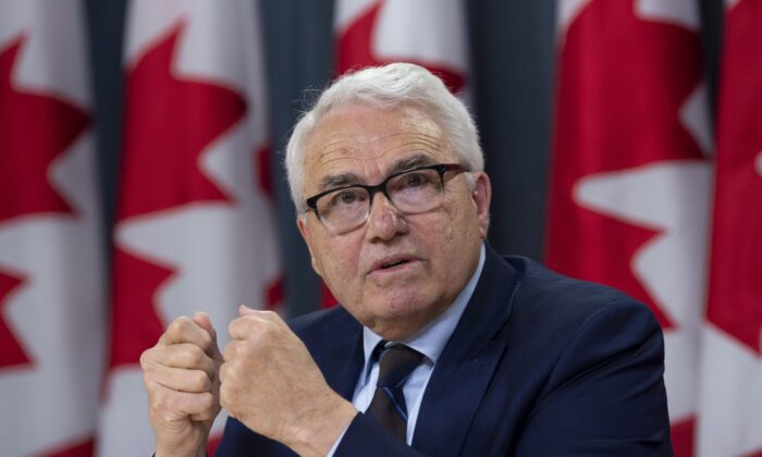 Official Languages Commissioner Raymond Theberge responds to a question during a news conference in Ottawa on May 9, 2019. (The Canadian Press/Adrian Wyld)