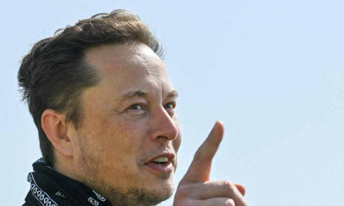 Tesla CEO Elon Musk gestures as he visits a Tesla factory in Berlin on Aug. 13, 2021. (Patrick Pleul/Pool via Reuters)