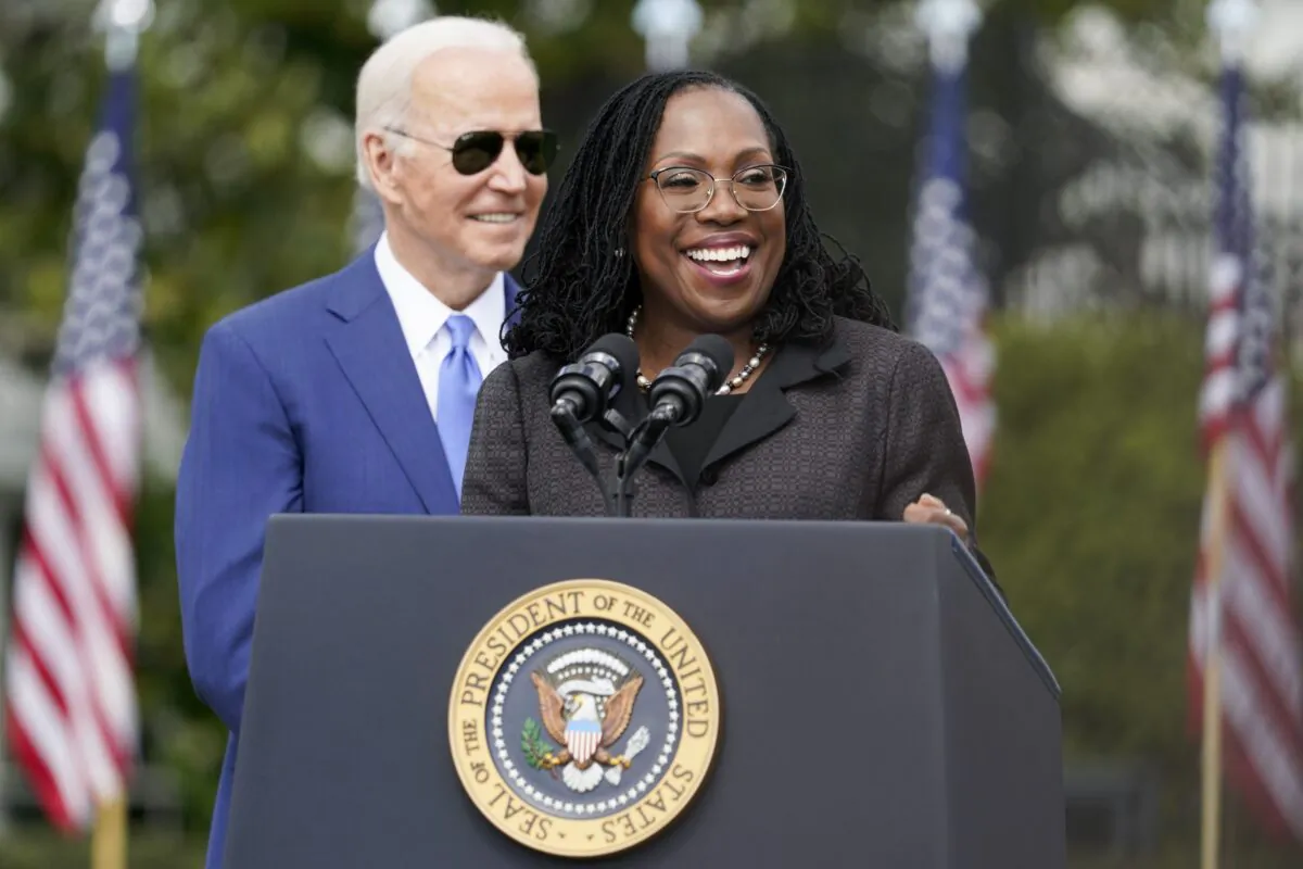 Judge Ketanji Brown Jackson speaks as U.S. President Joe Biden listens during an event celebrating Jackson’s confirmation to the Supreme Court, on the South Lawn of the White House in Washington on April 8, 2022. (AP Photo/Andrew Harnik)