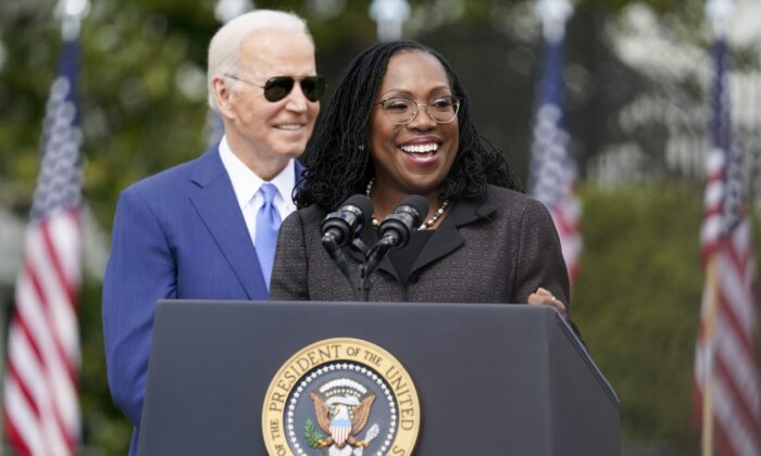 Judge Ketanji Brown Jackson speaks as U.S. President Joe Biden listens during an event celebrating Jackson’s confirmation to the Supreme Court, on the South Lawn of the White House in Washington on April 8, 2022. (AP Photo/Andrew Harnik)
