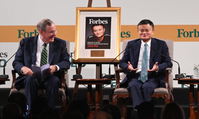 Jack Ma (R), co-founder and former executive chair of Alibaba Group, speaks next to Steve Forbes (L), chairman and editor-in-chief of Forbes media, during the Forbes Global CEO Conference in Singapore on October 15, 2019. (Photo by Roslan RAHMAN / AFP) (Photo by ROSLAN RAHMAN/AFP via Getty Images)