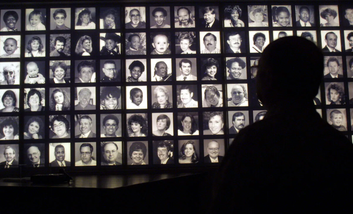 A visitor looks at the faces of some of the victims of the Oklahoma City bombing at the Oklahoma National Memorial museum in Oklahoma City June 12, 2001, one day after the execution of Timothy McVeigh. (Joe Raedle/Getty Images)