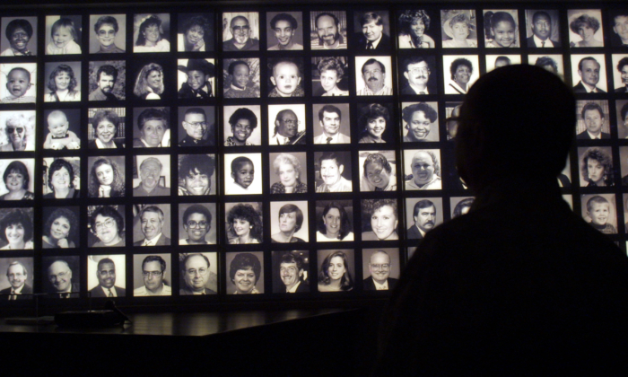 A visitor looks at the faces of some of the victims of the Oklahoma City bombing at the Oklahoma National Memorial museum in Oklahoma City June 12, 2001, one day after the execution of Timothy McVeigh. (Joe Raedle/Getty Images)