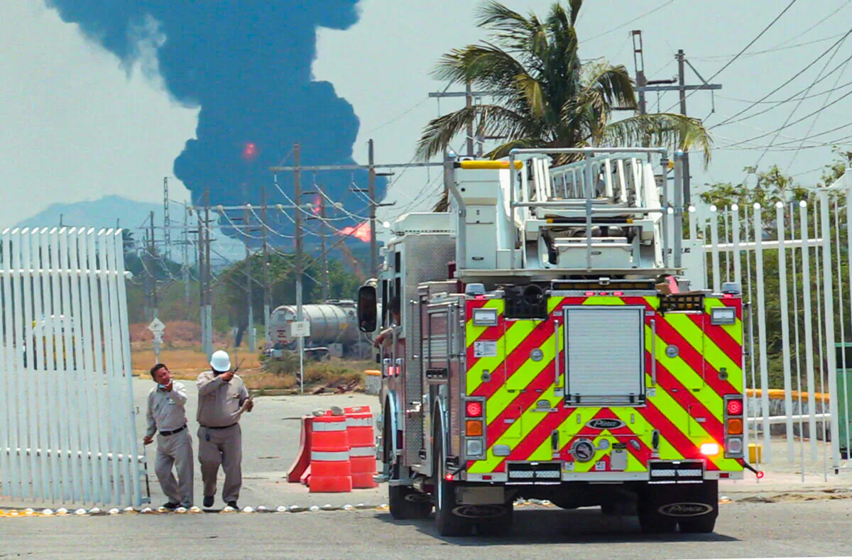 Mexican state oil company Pemex fights to quell a fire in a gasoline storage tank at the Salina Cruz refinery, in Salina Cruz, in the southern Oaxaca state, Mexico, on April 16, 2022. (Eduardo Barrera Zamora/Reuters)