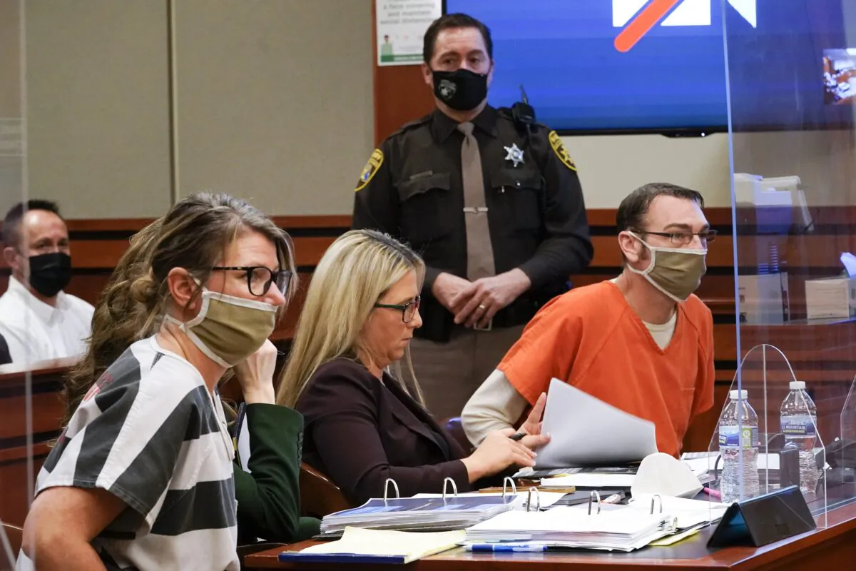 Jennifer Crumbley, (L), and James Crumbley, (R), the parents of Ethan Crumbley appear in court for a preliminary examination on involuntary manslaughter charges in Rochester Hills, Mich., on Feb. 8, 2022. (Paul Sancya/AP Photo)