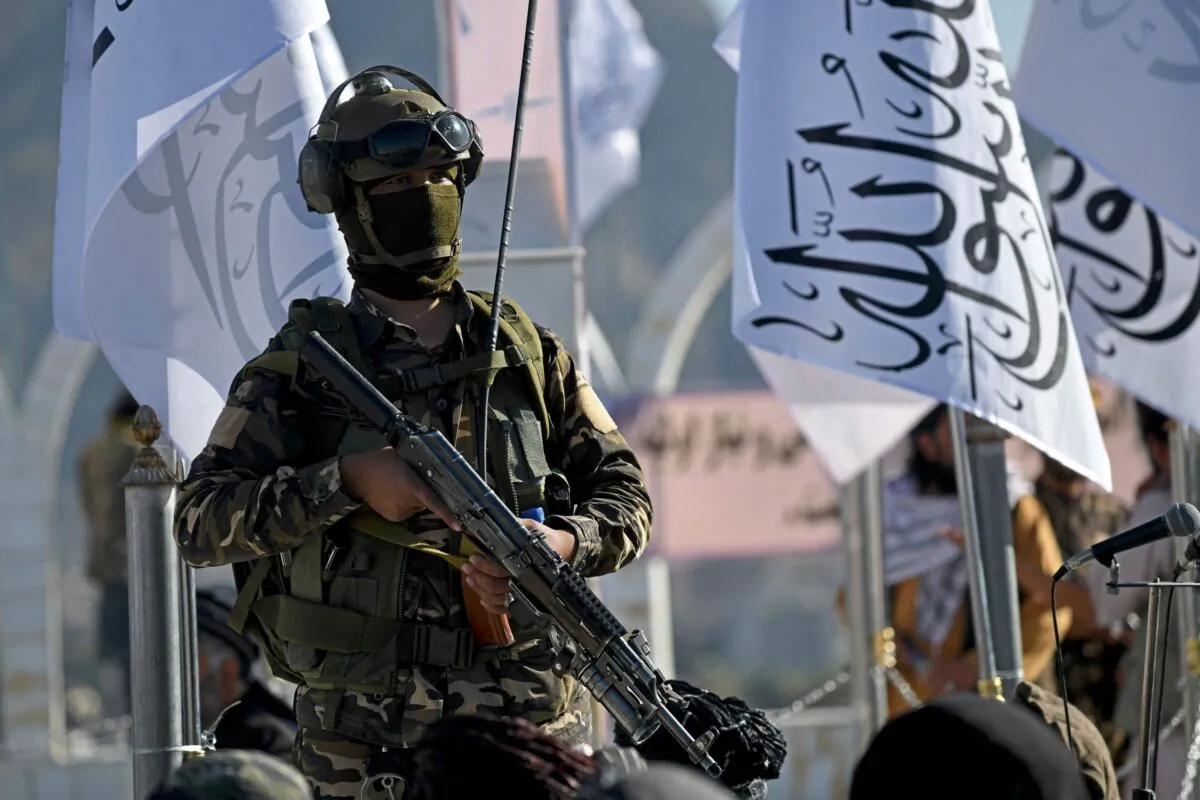 A Taliban extremist stands guard at the venue for a flag hoisting ceremony of the Taliban flag on the Wazir Akbar Khan hill in Kabul, on March 31, 2022. (Ahmad Sahel Arman/AFP via Getty Images)