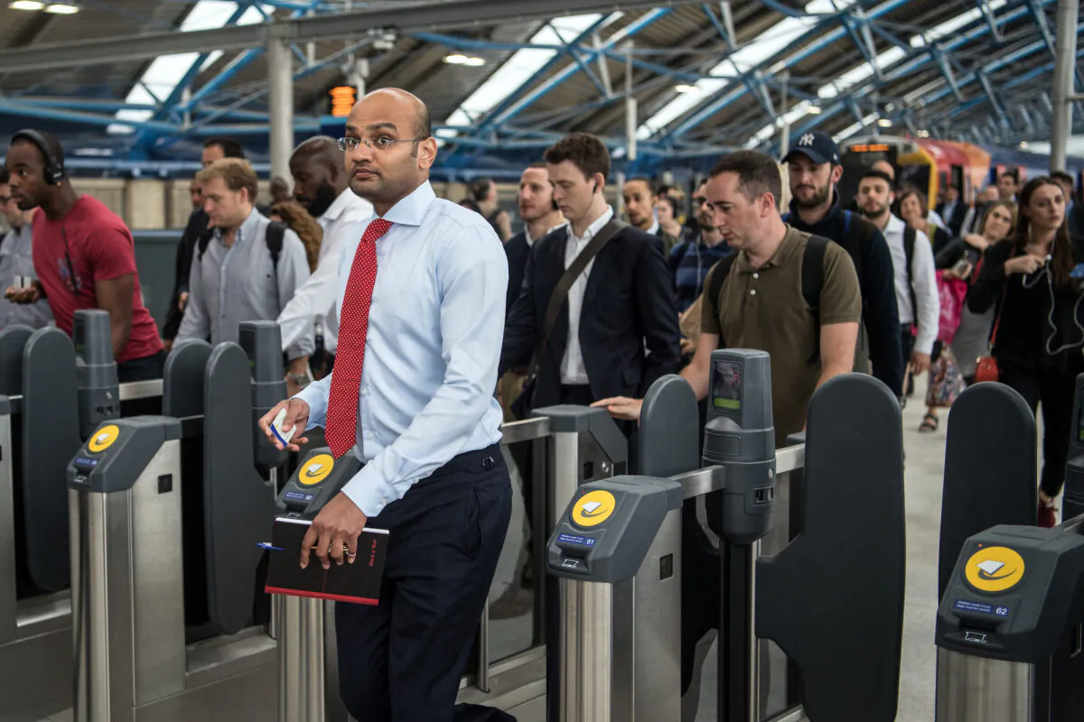 Commuters pass through ticket barriers at Waterloo Train Station, London on Aug. 7, 2017.(Carl Court/Getty Images)
