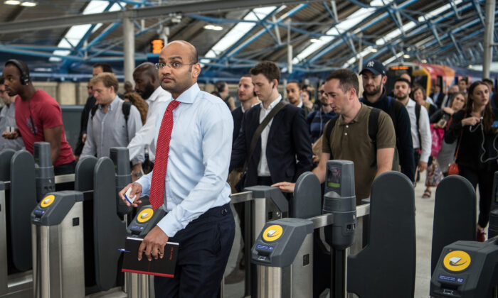 Commuters pass through ticket barriers at Waterloo Train Station, London on Aug. 7, 2017.(Carl Court/Getty Images)