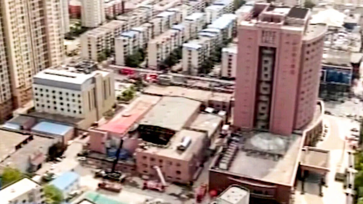 A building housing a swimming pool that collapsed, killing at least 3, in China's central Henan Province on April 18, 2022. (CCTV via AP/Screenshot via The Epoch Times)