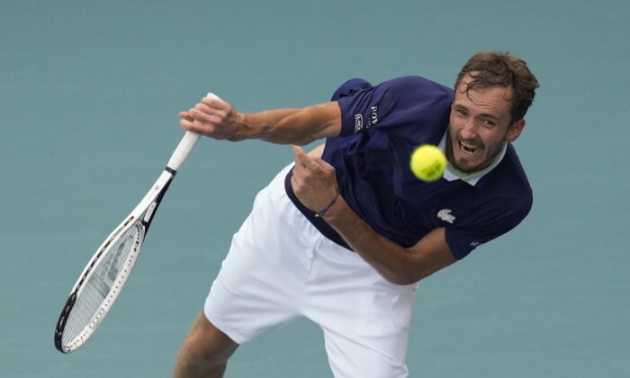 Daniil Medvedev of Russia serves in his men's quarterfinal match against Hubert Hurkacz of Poland at the Miami Open tennis tournament in Miami Gardens, Fla., on March 31, 2022. (Rebecca Blackwell/AP Photo)