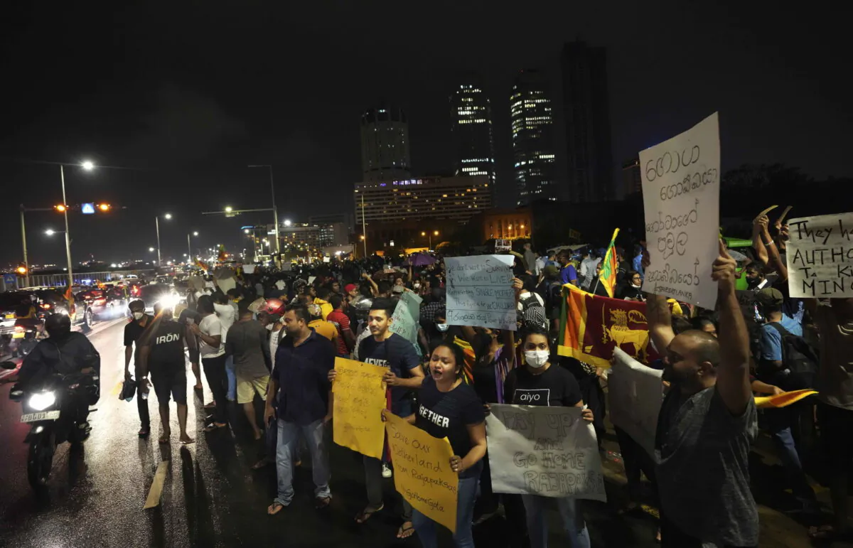 Sri Lankans protest outside the Sir Lankan president's office in Colombo, Sri Lanka, on April 11, 2022. (Eranga Jayawardena/AP Photo)