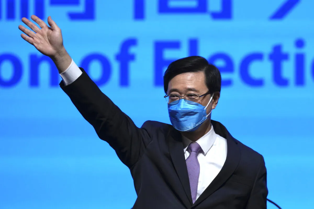 John Lee, former No. 2 official in Hong Kong, and the only candidate for the city's top job, announces his manifesto during the 2022 chief executive electoral campaign in Hong Kong, on April 29, 2022. (AP Photo/Kin Cheung)