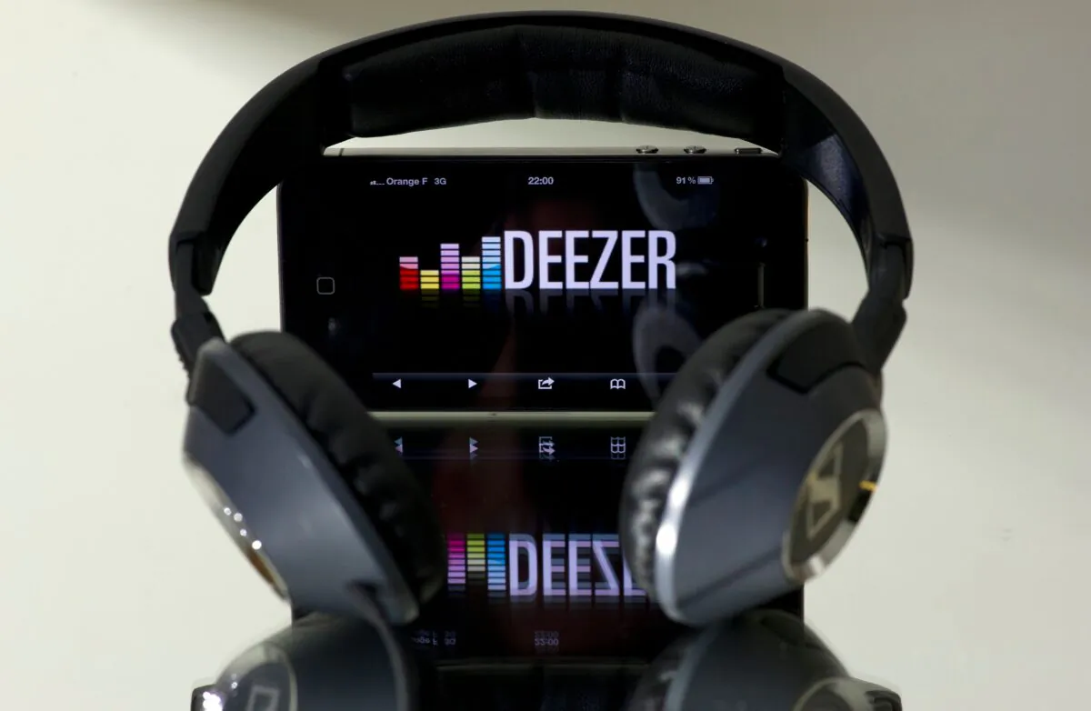 Headphone beside a smartphone connected to French music streaming website Deezer in Paris, on Oct. 9, 2012. (Lionel Bonaventure/AFP via Getty Images)