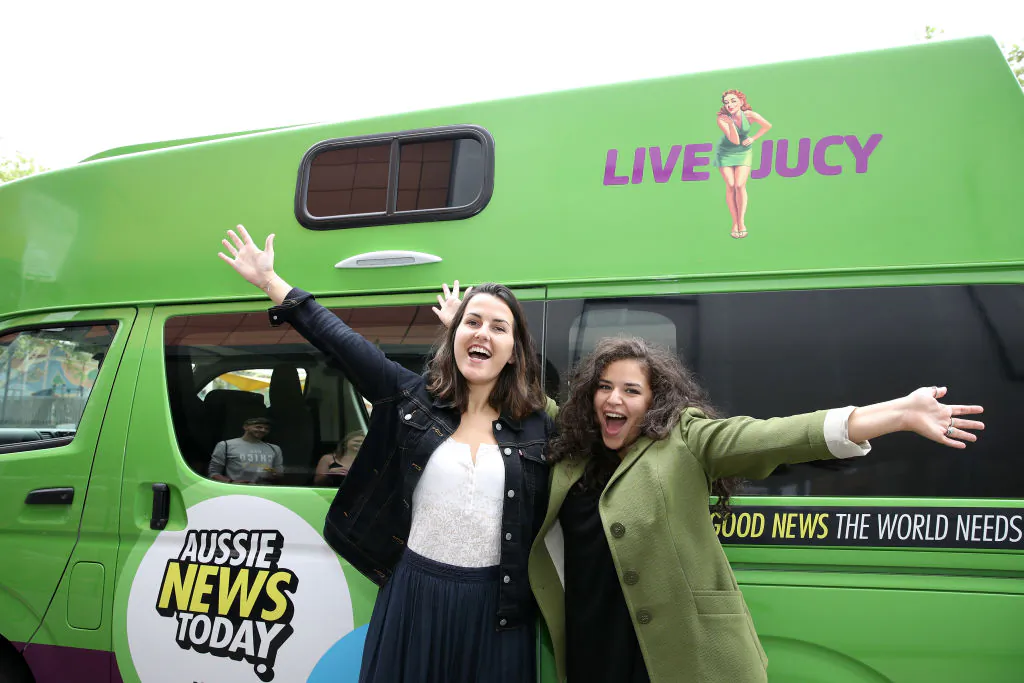 Buzzfeed Mates Aurore DuPont-Sagorin and Anna Mazzilli of France pose with a Juicy campervan at the launch of Aussie News Today, as part of Tourism Australia's new youth campaign on Oct. 6, 2017 in Sydney, Australia.  (Cameron Spencer/Getty Images for Tourism Australia)