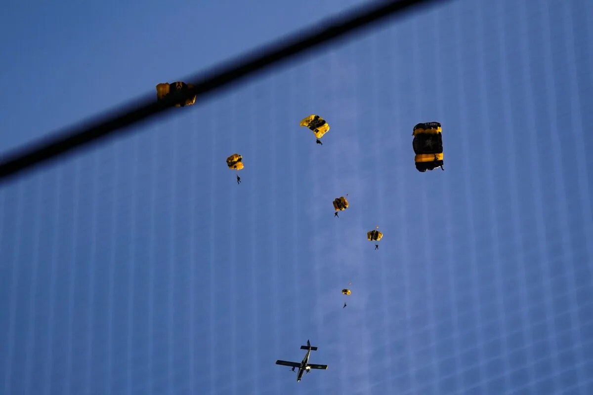 The U.S. Army Parachute Team the Golden Knights jump out of their aircraft before a baseball game between the Washington Nationals and the Arizona Diamondbacks at Nationals Park in Washington, on April 20, 2022. (Alex Brandon/AP Photo)