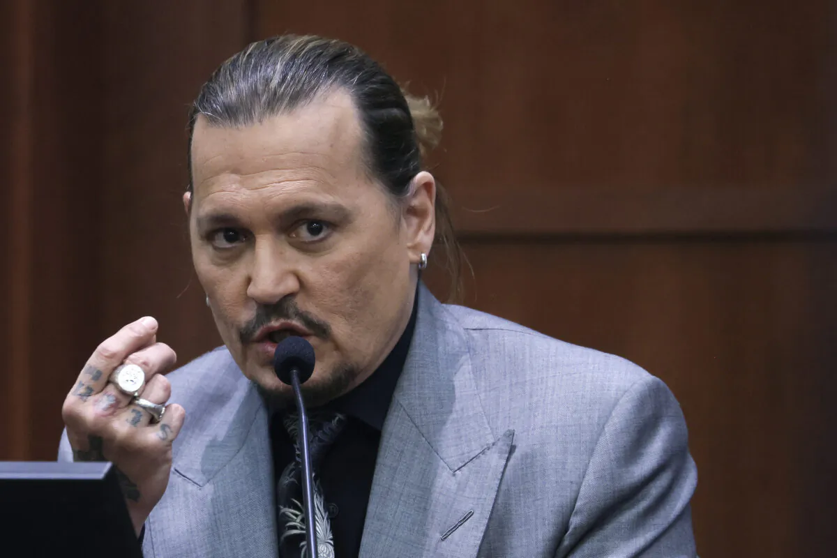 Actor Johnny Depp takes a stand during his defamation trial against his ex-wife Amber Heard at the Fairfax County Circuit Courthouse in Fairfax, Va., on April 20, 2022. (Evelyn Hockstein/Pool via AP)