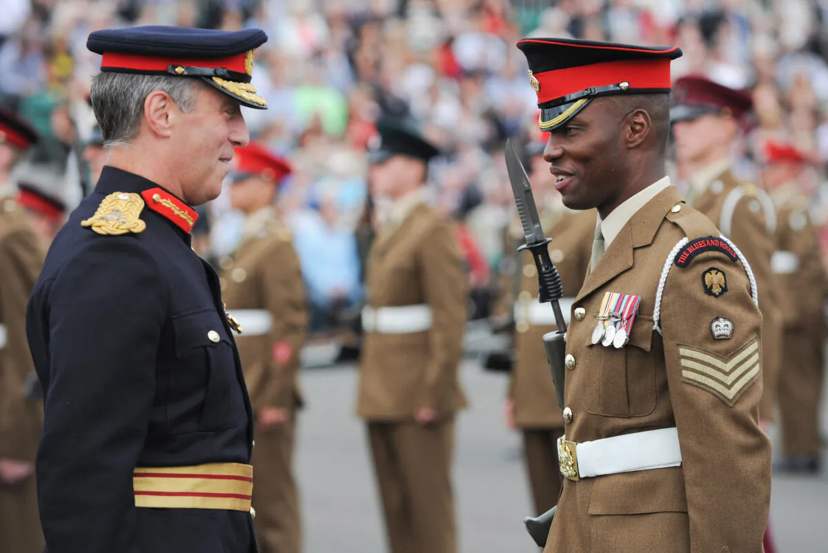 A British Major General speaks with one of the soldiers responsible for training Junior soldiers at a graduation parade in Harrogate, England,  on Aug. 15, 2013. (Ian Forsyth/Getty Images)