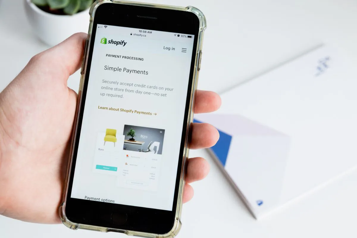 Stock photo of the Shopify website on a mobile device. (Roberto Cortese/Unsplash)