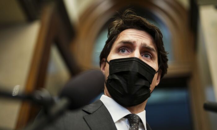 Prime Minister Justin Trudeau talks to reporters as he arrives to the House of Commons for question period on Parliament Hill in Ottawa on April 5, 2022. (The Canadian Press/Sean Kilpatrick)