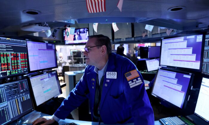 A trader works on the trading floor at the New York Stock Exchange (NYSE) in Manhattan, New York City, on April 11, 2022. (Andrew Kelly/Reuters)