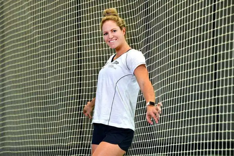 Swimmer Emily Seebohm is seen posing for a photograph after a training session in the nets at the National Cricket Centre in Brisbane, Wednesday, March 20, 2019. (AAP Image/Darren England)