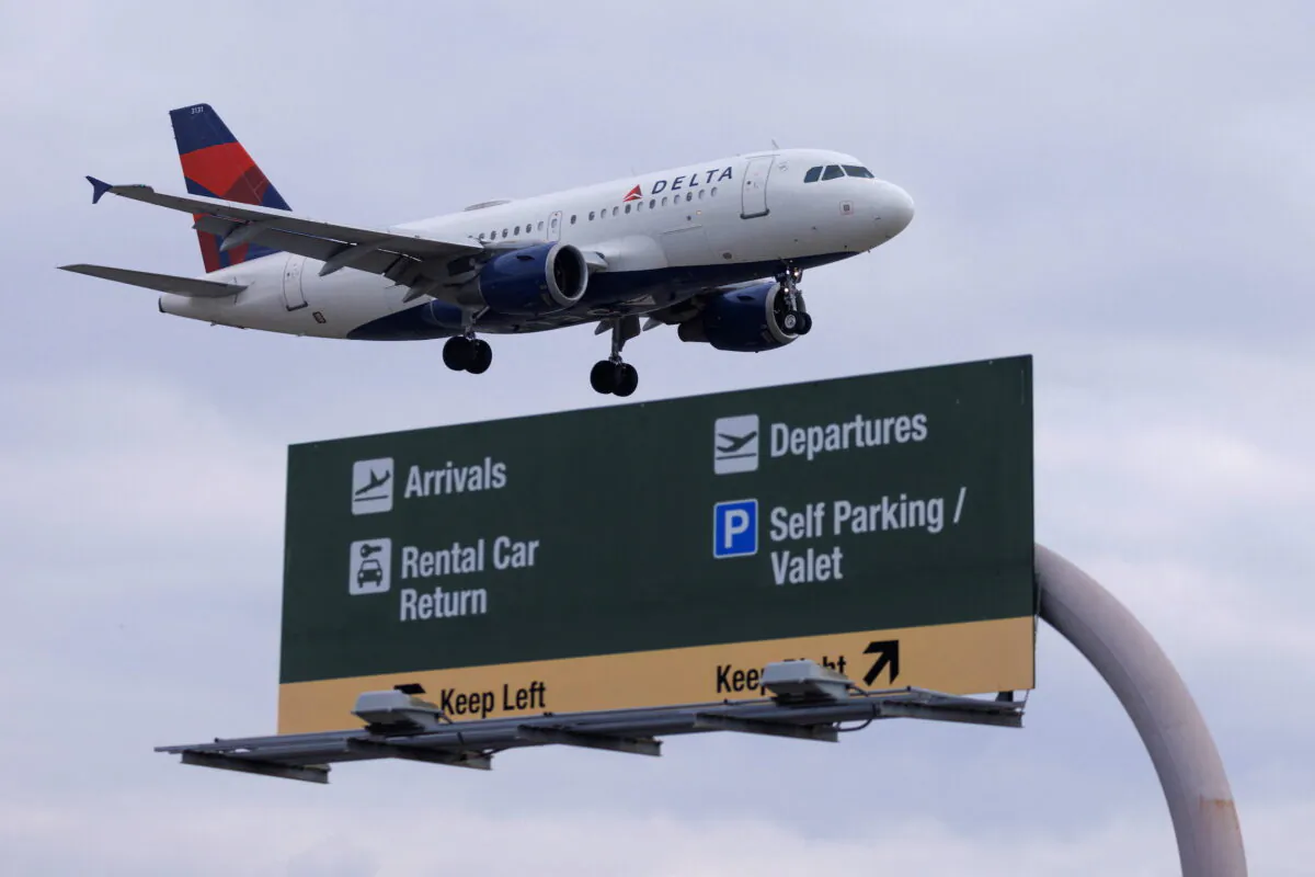 A Delta Airlines commercial aircraft approaches to land at John Wayne Airport in Santa Ana, Calif., on Jan. 18, 2022. (Mike Blake/Reuters)