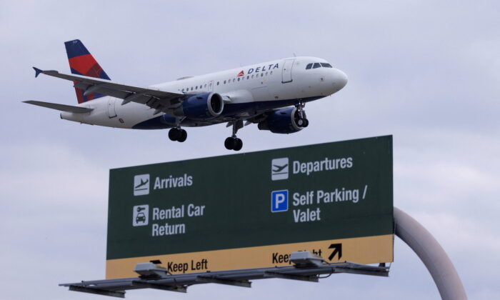 A Delta Airlines commercial aircraft approaches to land at John Wayne Airport in Santa Ana, Calif., on Jan. 18, 2022. (Mike Blake/Reuters)