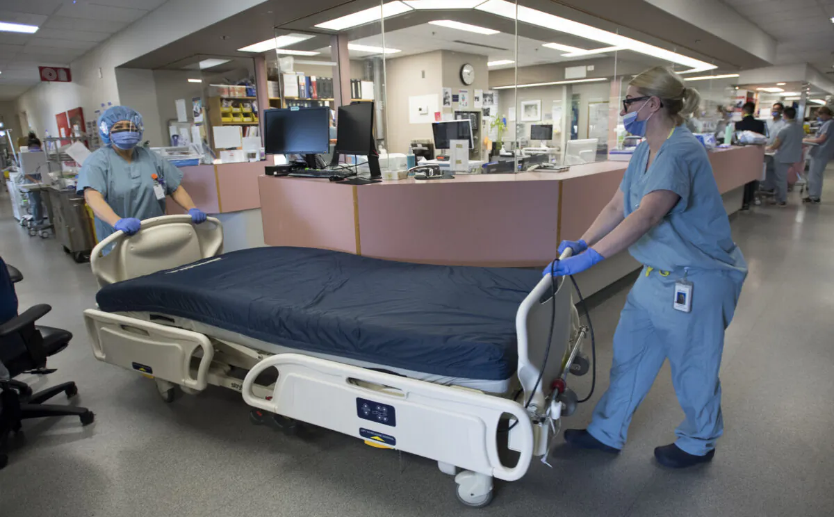 A bed in need of cleaning is moved in the COVID-19 intensive care unit at St. Paul’s hospital in downtown Vancouver on April 21, 2020. (The Canadian Press/Jonathan Hayward)