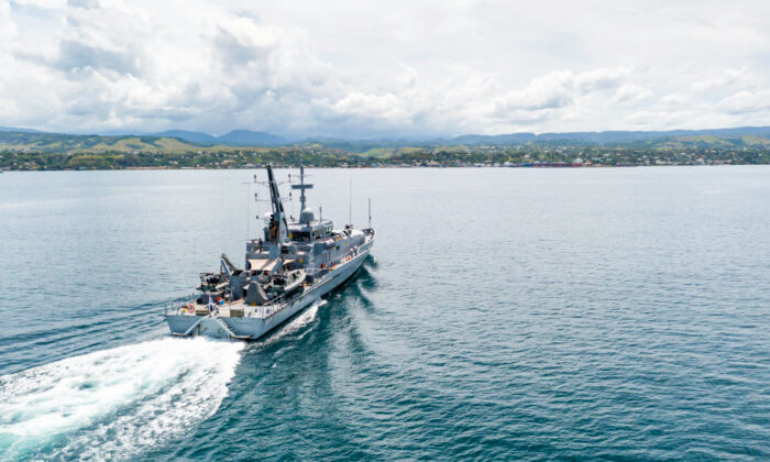 In this handout provided by the Australian Department of Defence, Armadale Class Patrol Boat, HMAS Armidale, sails into the Port of Honiara, Guadalcanal Island, Solomon Islands, on Dec. 1, 2021. (CPL Brodie Cross/Australian Department of Defence via Getty Images)