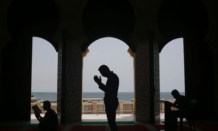 Palestinians pray at the al-Khaldi mosque on the third day of the Muslim holy month of Ramadan in Gaza City, on June 8, 2016. 
(Mohammed Abed/AFP via Getty Images)