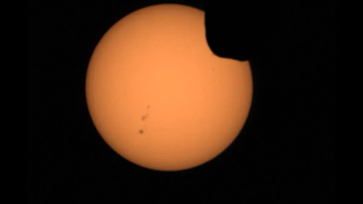 One of Mars' two moons eclipsing the sun, in a still from a video, on April 20, 2022. (NASA via AP/Screenshot via The Epoch Times)