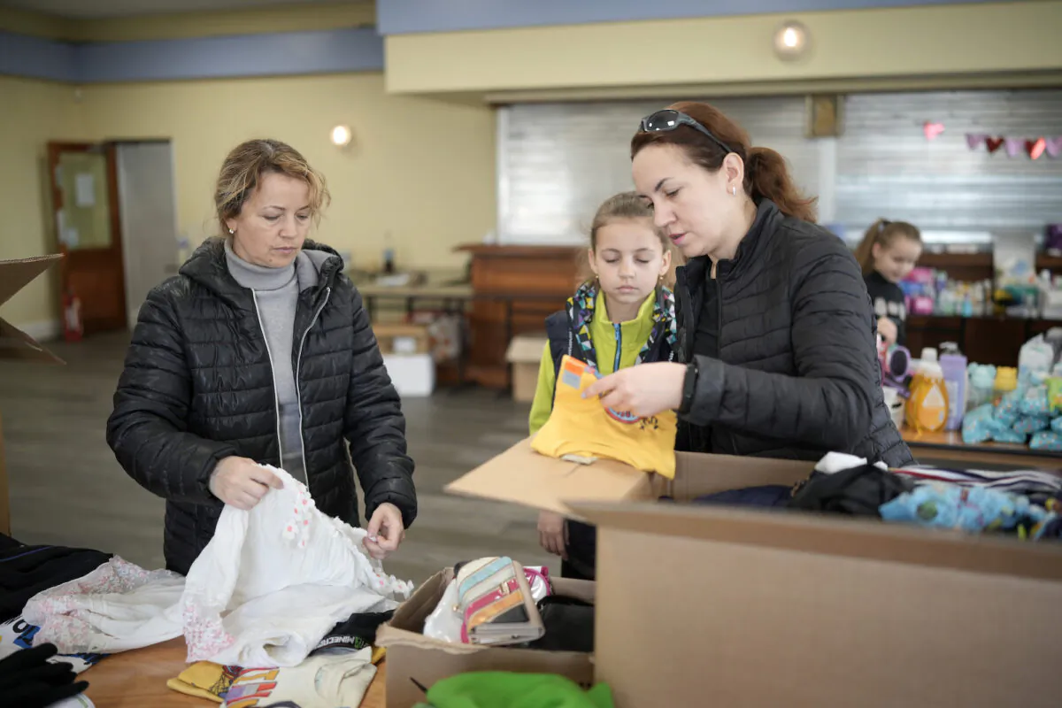 Ukrainian refugees sorting out humanitarian aid for compatriots in the UK and Ukraine in Manchester, England, on March 29, 2022. (Christopher Furlong/Getty Images)