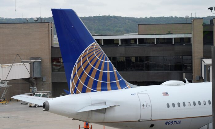Company logo adorns the tail of a United Airlines jetliner being prepared for departure at Eppley Airfield in Omaha, Neb., on Oct. 6, 2021. (David Zalubowski/AP Photo)