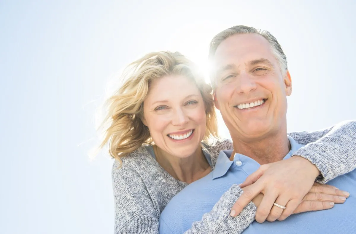 Happy couple enjoys retirement life. (tmcphotos/ShutterStock)