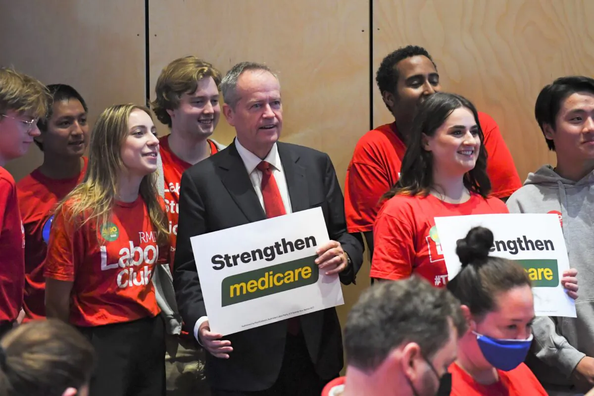 Shadow NDIS Minister Bill Shorten poses for photographs ahead of a speech by Australian Opposition Leader Anthony Albanese to the Australian Nursing and Midwifery Federation on Day 3 of the 2022 federal election campaign, in Melbourne, Australia on April 13, 2022. (AAP Image/Lukas Coch)
