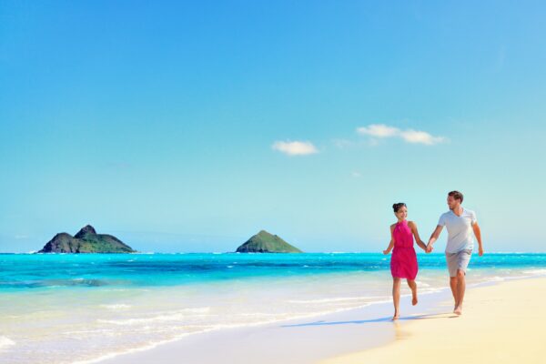 A couple on the beach in Oahu, Hawaii.