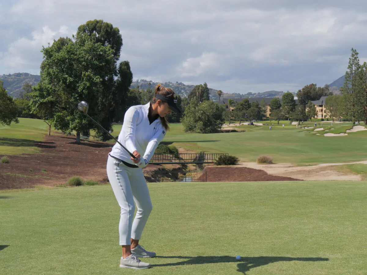 Alison Lee hits tee shot on the par four 11th hole in the opening round of The DIO Implant LA Open, at Wilshire Country Club, in Los Angeles, on April 21, 2022. (Nhat Hoang/The Epoch Times)