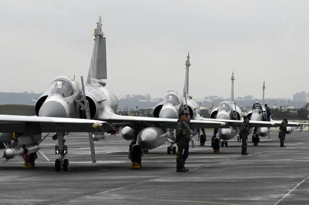 Whether or not China plans to invade Taiwan now, it is time for the United States to ditch decades of misguided policy. Among other things, Washington should, on an emergency basis, begin arming the island with the weapons it urgently needs. Pictured: Taiwan Air Force pilots stand next to Mirage fighter jets at Hsinchu Air Base on Jan. 16, 2019. (Sam Yeh/AFP via Getty Images)