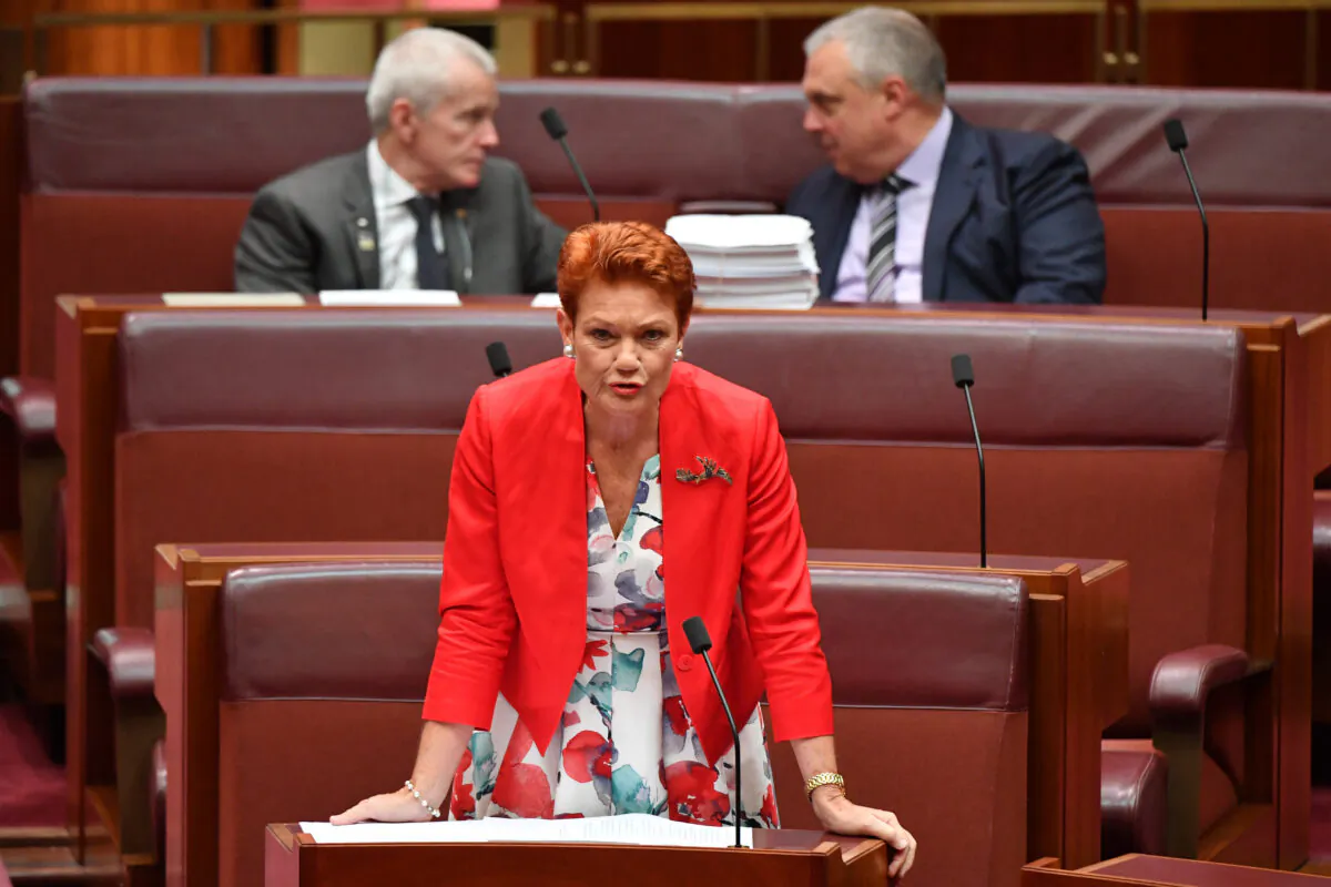 Senator Pauline Hanson speaks as Senators Malcolm Roberts (top left) and Stirling Griff (top right) look on during debate of the Fair Work Amendment Bill 2021 in the Senate at Parliament House on March 18, 2021 in Canberra, Australia. Senator Stirling Griff has issued a statement confirming that Centre Alliance only supports changes to casuals provisions and wage theft and will not support the rest of the Industrial Relations omnibus bill. (Photo by Sam Mooy/Getty Images)