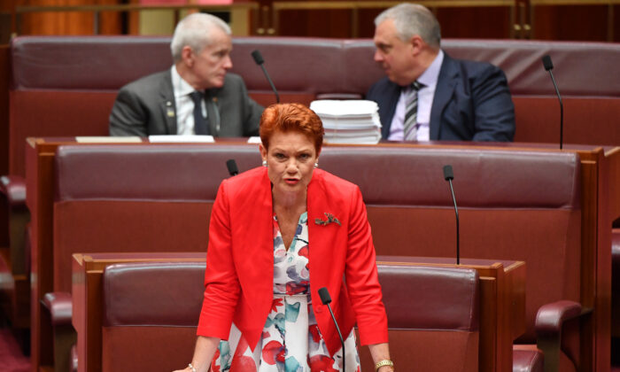 Senator Pauline Hanson speaks as Senators Malcolm Roberts (top left) and Stirling Griff (top right) look on during debate of the Fair Work Amendment Bill 2021 in the Senate at Parliament House on March 18, 2021 in Canberra, Australia. Senator Stirling Griff has issued a statement confirming that Centre Alliance only supports changes to casuals provisions and wage theft and will not support the rest of the Industrial Relations omnibus bill. (Photo by Sam Mooy/Getty Images)