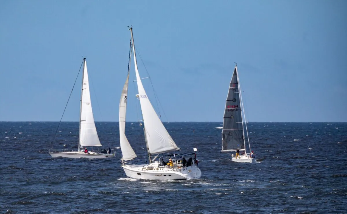 Sailors partake in the Newport to Ensenada International Yacht Race off the coast of Newport Beach, Calif., on April 22, 2022. (John Fredricks/The Epoch Times)