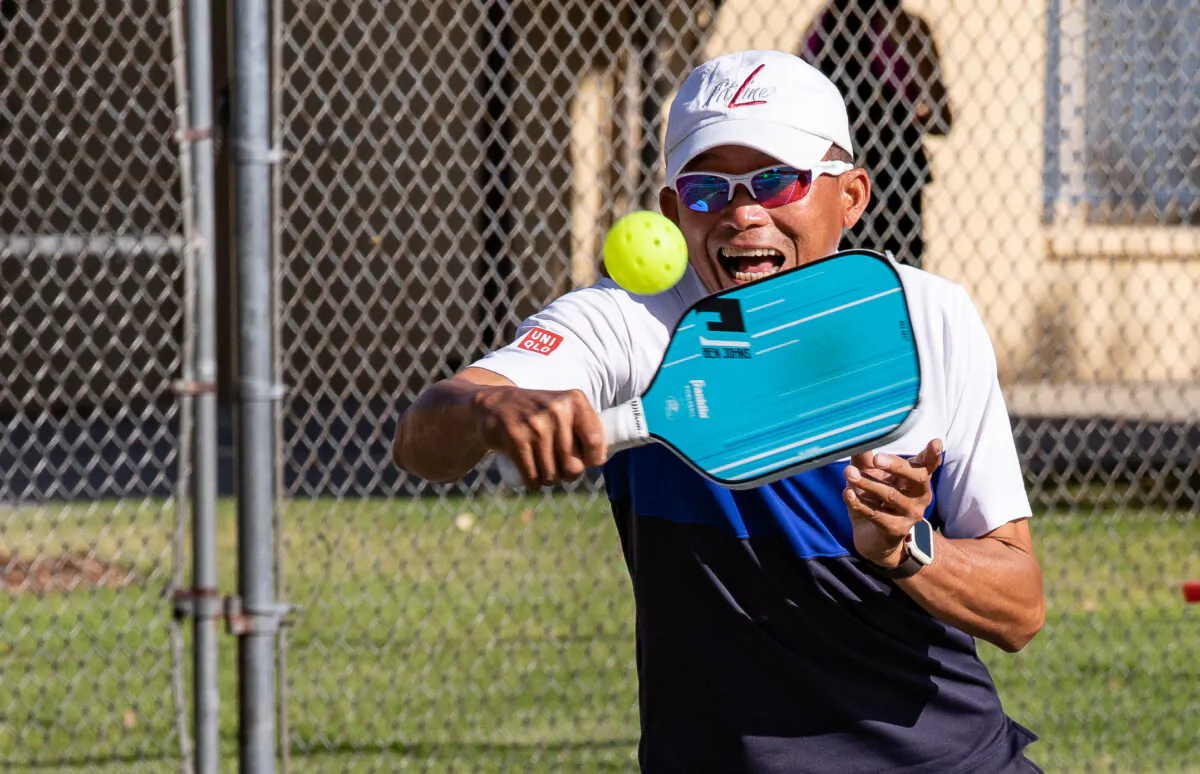 People play the sport of Pickleball at Hart Park in Orange, Calif., on April 21, 2022. (John Fredricks/The Epoch Times)