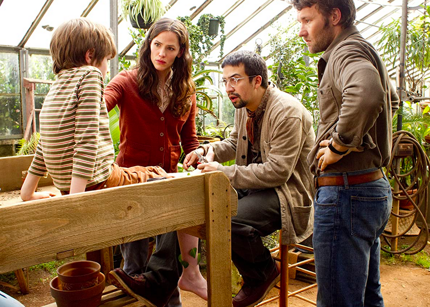 two men, a woman, and a boy, in a greenhouse in The Odd Life of Timothy Green 