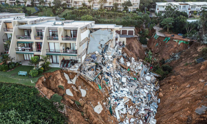 This aerial view shows the destruction at Umdloti beach north of Durban, on April 14, 2022. - Victims of South Africa's deadliest storm on record scrambled to get help on April 14, 2022 as relief teams struggled to cross bridges and roads wrecked by floods and landslides.
At least 341 people died when the heaviest rainfall in six decades swept away homes and destroyed infrastructure in the city of Durban and KwaZulu-Natal province. (Photo by MARCO LONGARI / AFP) (Photo by MARCO LONGARI/AFP via Getty Images)