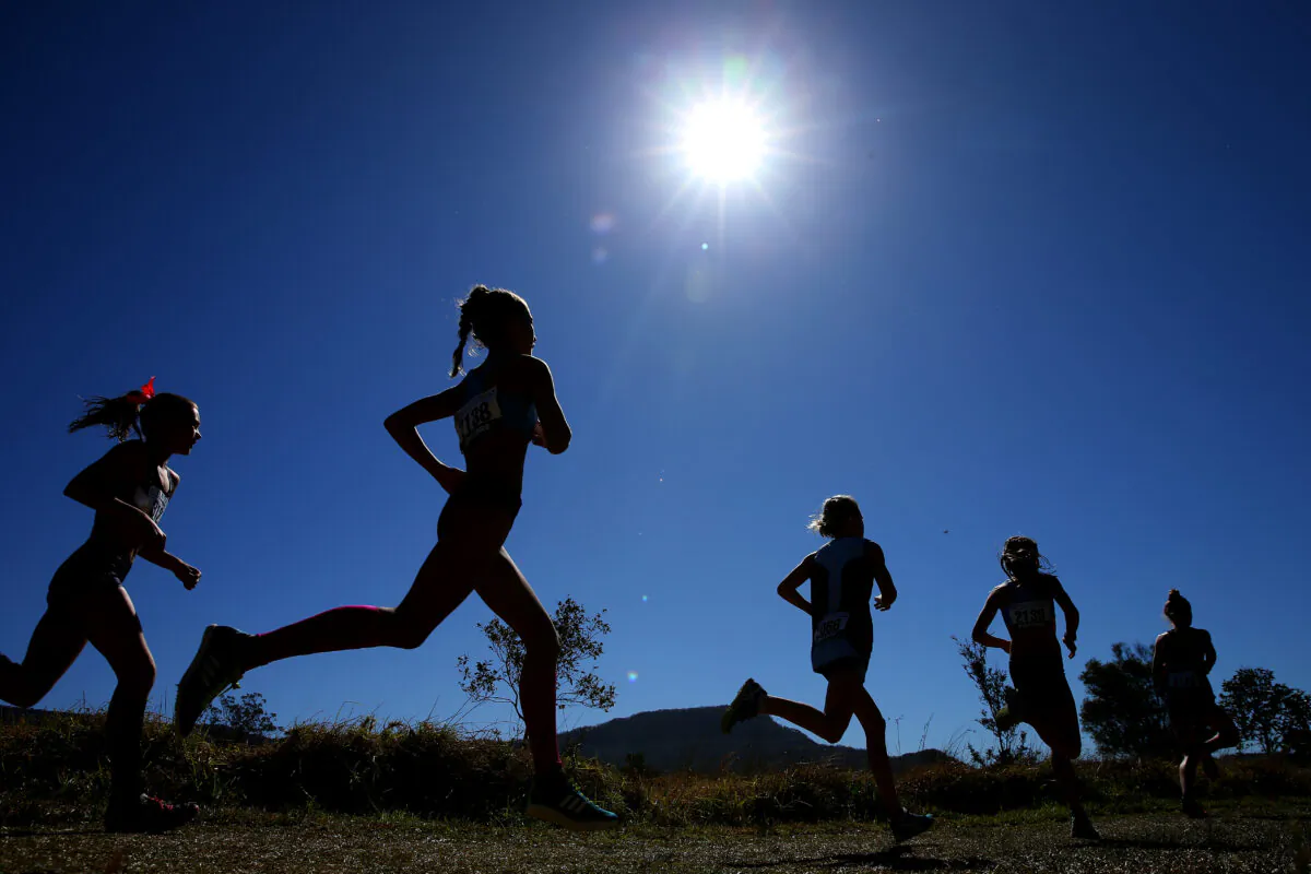 Competitors race in the Girls 13 years 3k U14 event during the Australian Cross-Country Championships at Kembla Grange in Wollongong, Australia, on Aug. 24, 2019. (Jason McCawley/Getty Images)