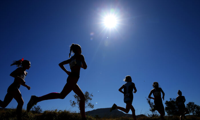 Competitors race in the Girls 13 years 3k U14 event during the Australian Cross-Country Championships at Kembla Grange in Wollongong, Australia, on Aug. 24, 2019. (Jason McCawley/Getty Images)